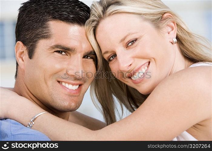 Portrait of a young woman and a mid adult man smiling