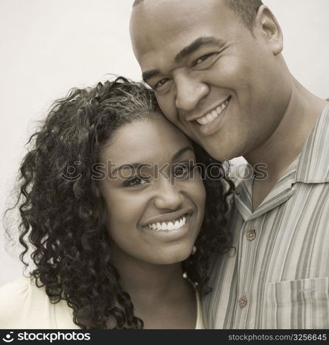 Portrait of a young woman and a mid adult man smiling