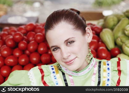 Portrait of a young woman at a market stall