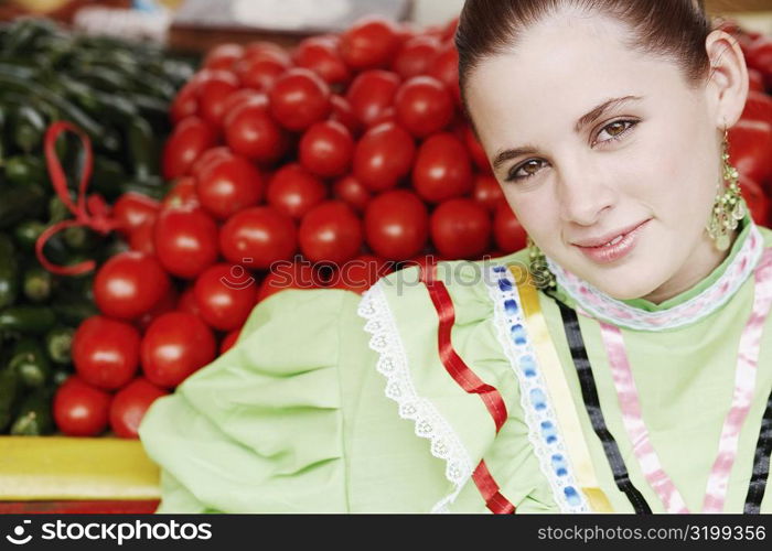 Portrait of a young woman at a market stall