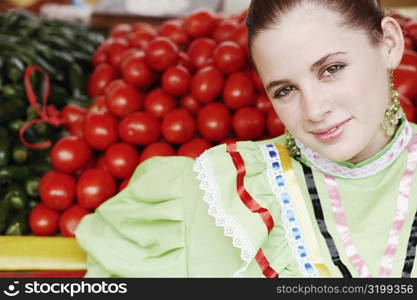 Portrait of a young woman at a market stall