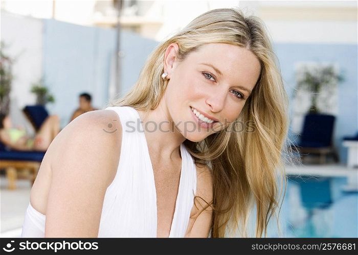 Portrait of a young woman at the poolside