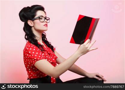 Portrait of a young woman, college student or teacher notebook in hand