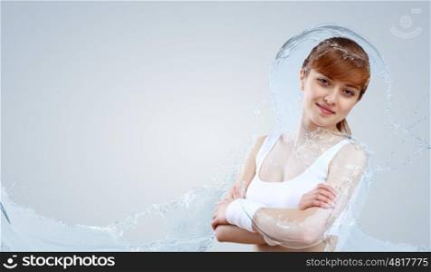 Portrait of a young woman doing sport with a bottle of pure water. Portrait of a young woman doing sport