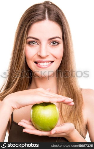 Portrait of a young woman eating green apple