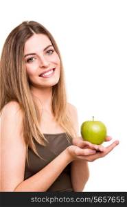 Portrait of a young woman eating green apple