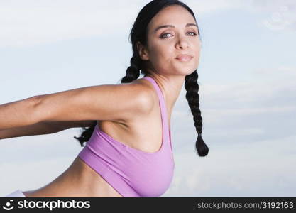 Portrait of a young woman exercising