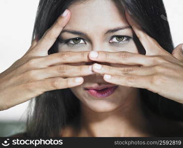 Portrait of a young woman gesturing