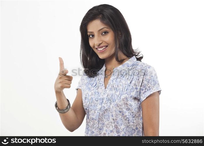 Portrait of a young woman gesturing