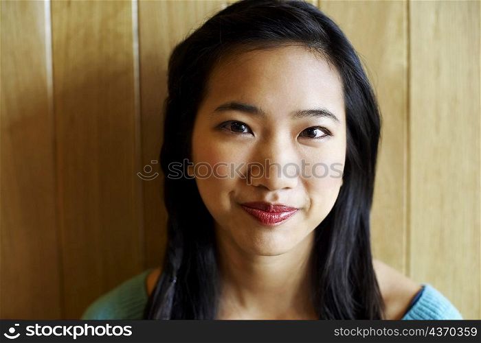 Portrait of a young woman grinning