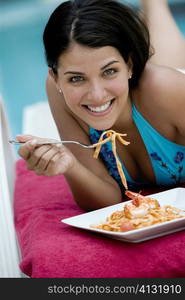 Portrait of a young woman having a meal