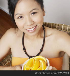 Portrait of a young woman holding a bowl