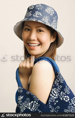 Portrait of a young woman holding a hand bag