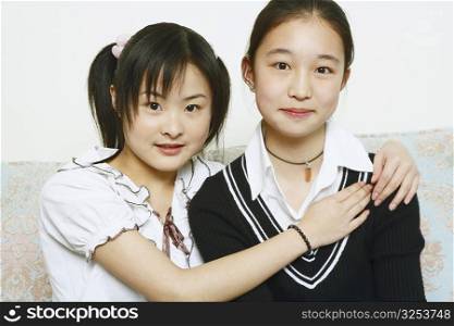 Portrait of a young woman hugging her friend