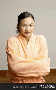 Portrait of a young woman in a bathrobe
