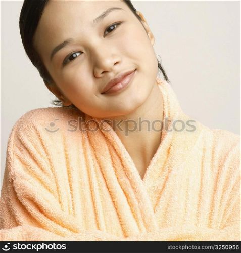 Portrait of a young woman in a bathrobe