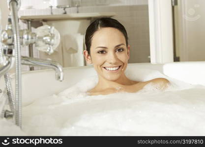 Portrait of a young woman in a bathtub