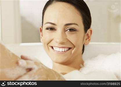 Portrait of a young woman in a bathtub