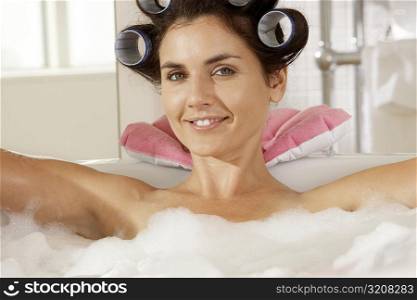 Portrait of a young woman in a bubble bath