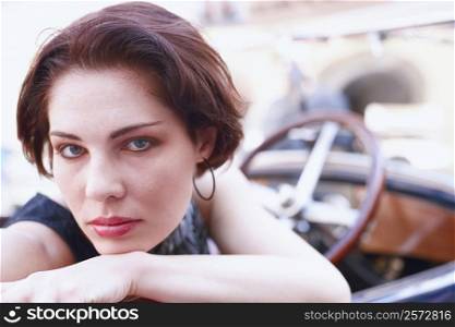 Portrait of a young woman in a car