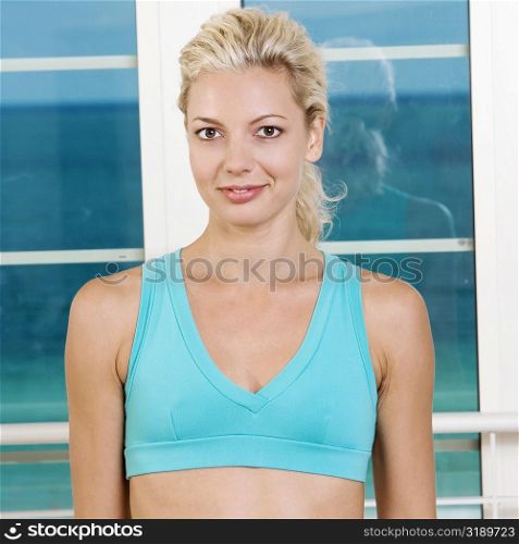 Portrait of a young woman in a sports bra