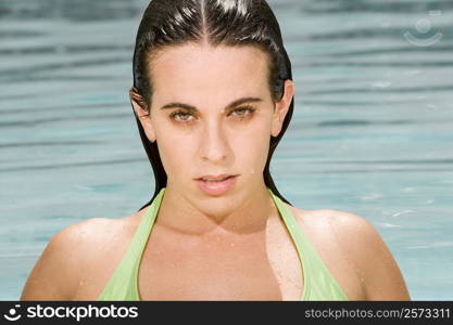 Portrait of a young woman in a swimming pool