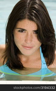 Portrait of a young woman in a swimming pool