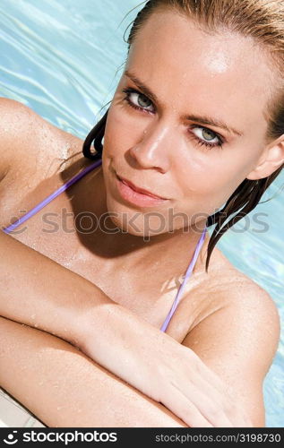 Portrait of a young woman in a swimming pool