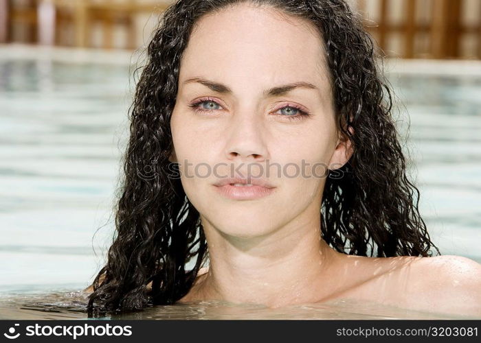 Portrait of a young woman in a swimming pool