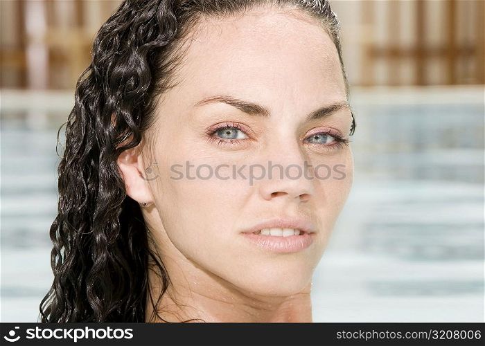 Portrait of a young woman in a swimming pool