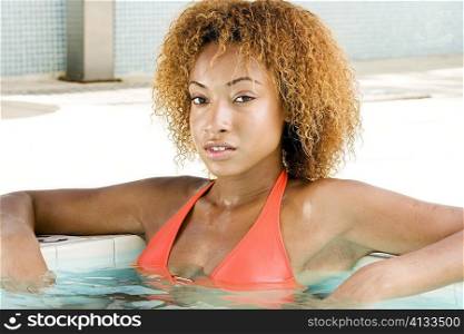 Portrait of a young woman in a swimming pool