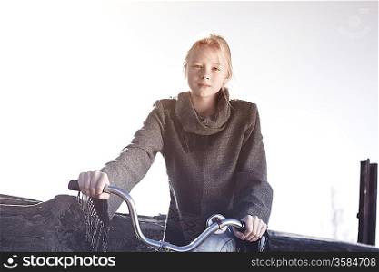 portrait of a young woman in a wool sweater in nature, spring autumn fashion