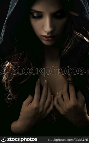 Portrait of a young woman in hood