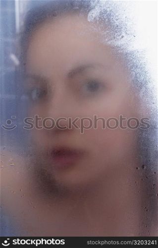 Portrait of a young woman in the bathroom