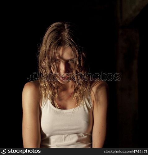 Portrait of a young woman in the dark