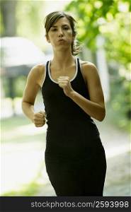 Portrait of a young woman jogging