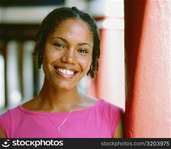 Portrait of a young woman leaning against a column, Bermuda