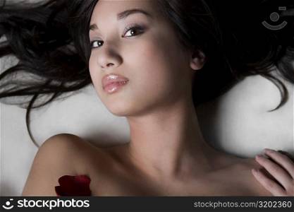 Portrait of a young woman lying on a massage table