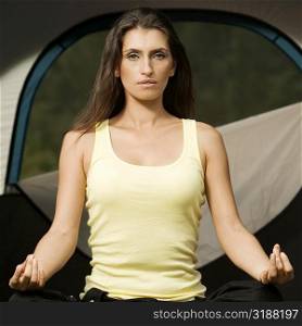 Portrait of a young woman meditating