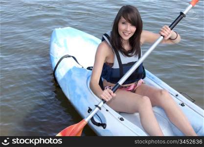 portrait of a young woman on a kayak