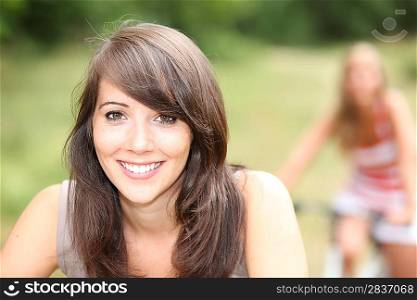 portrait of a young woman on bike
