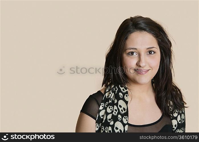 Portrait of a young woman over colored background