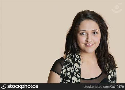 Portrait of a young woman over colored background