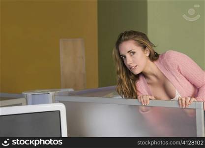 Portrait of a young woman peeking