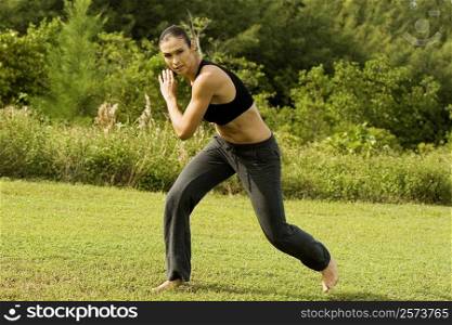 Portrait of a young woman practicing martial arts