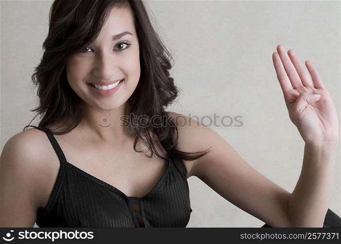 Portrait of a young woman practicing yoga and smiling