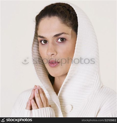 Portrait of a young woman praying