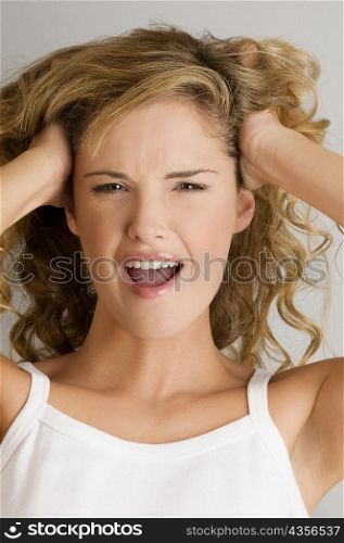 Portrait of a young woman shouting