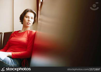 Portrait of a young woman sitting