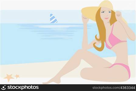 Portrait of a young woman sitting on the beach